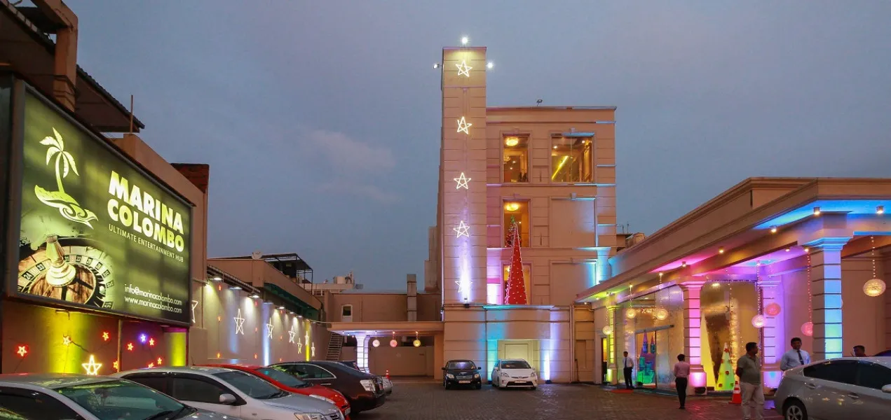 Casino Marina Colombo building and car park on Marine Drive in the evening